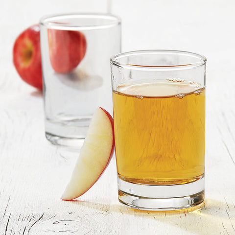 Libbey juice glass set of four on a dining table for stylish service.