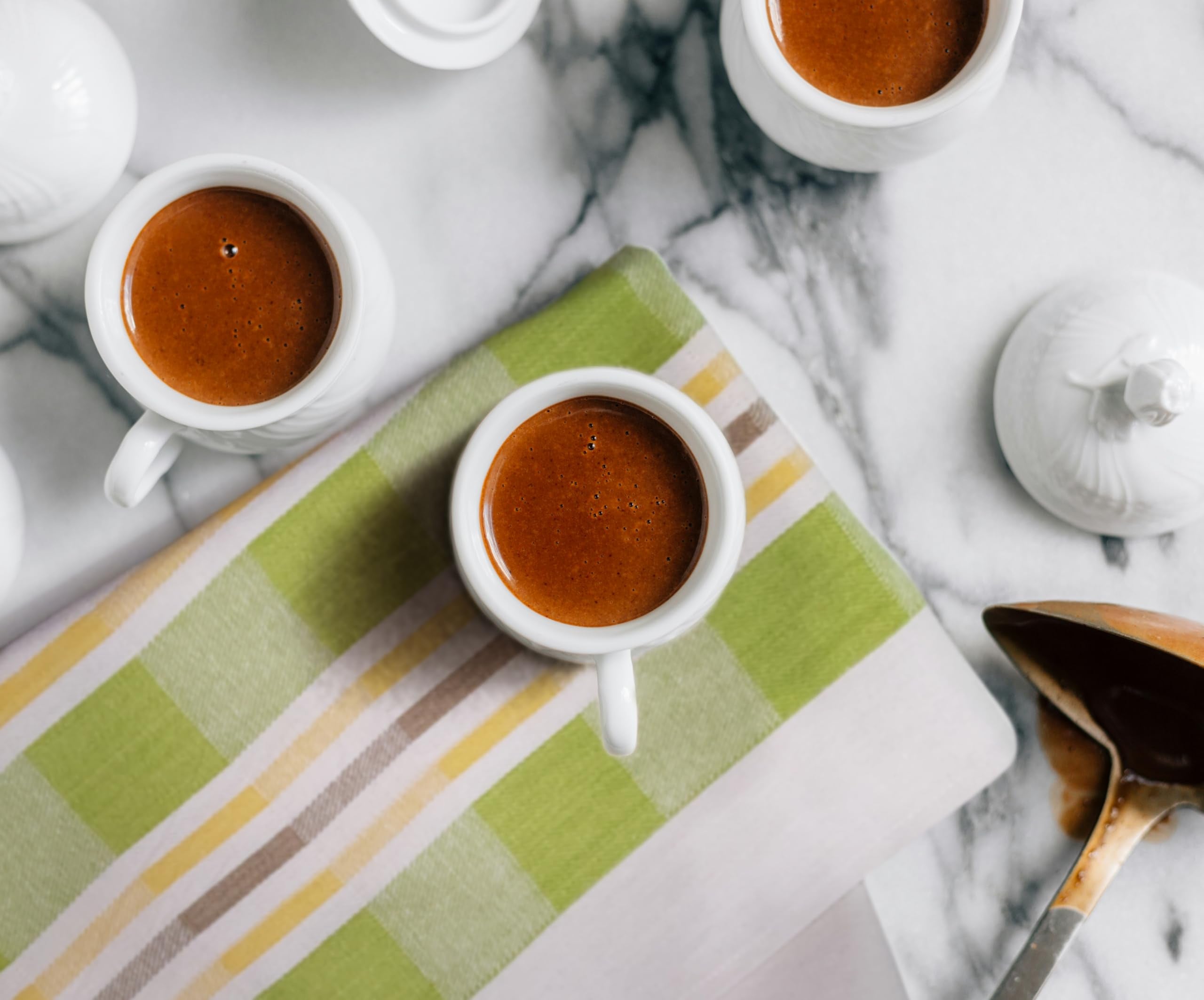 Checker-pattern Lincoln & Palm towel adds European charm to home or cafe kitchens.