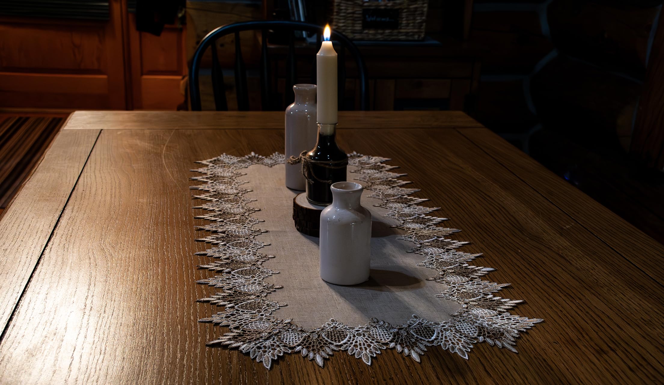 Linens, Art and Things lace runner coordinates with placemats for cohesive decor.