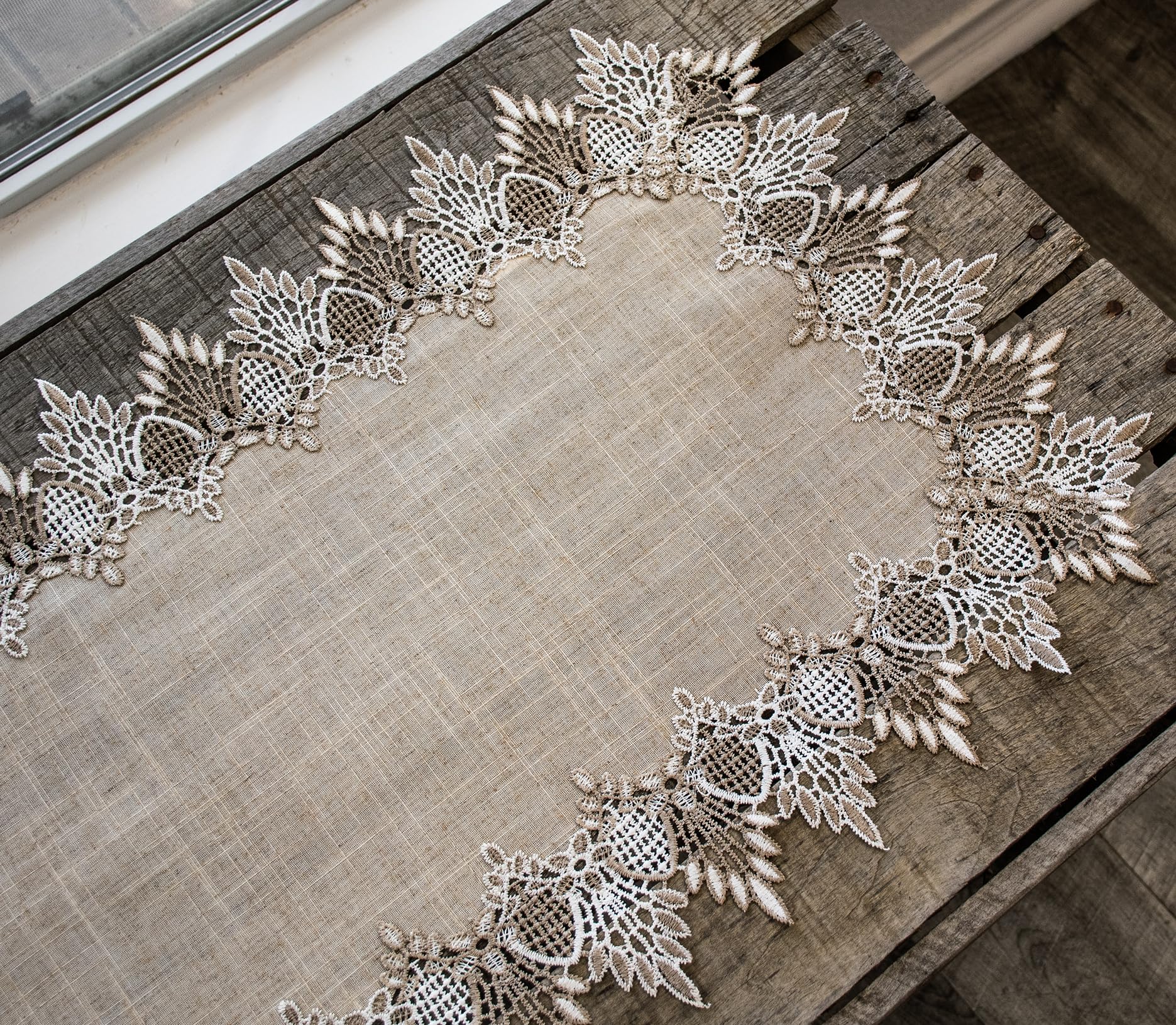 Linens, Art and Things lace runner complements festive tables and everyday meals.
