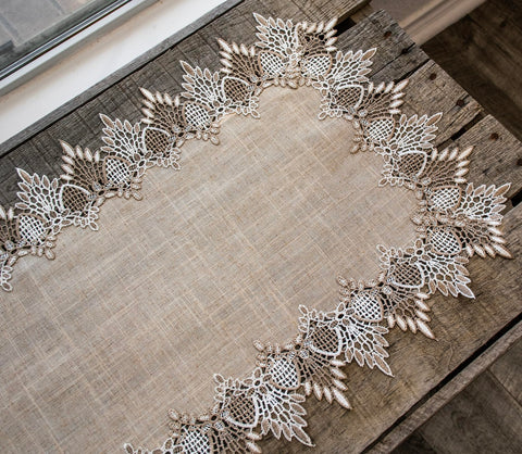 Linens, Art and Things lace runner complements festive tables and everyday meals.