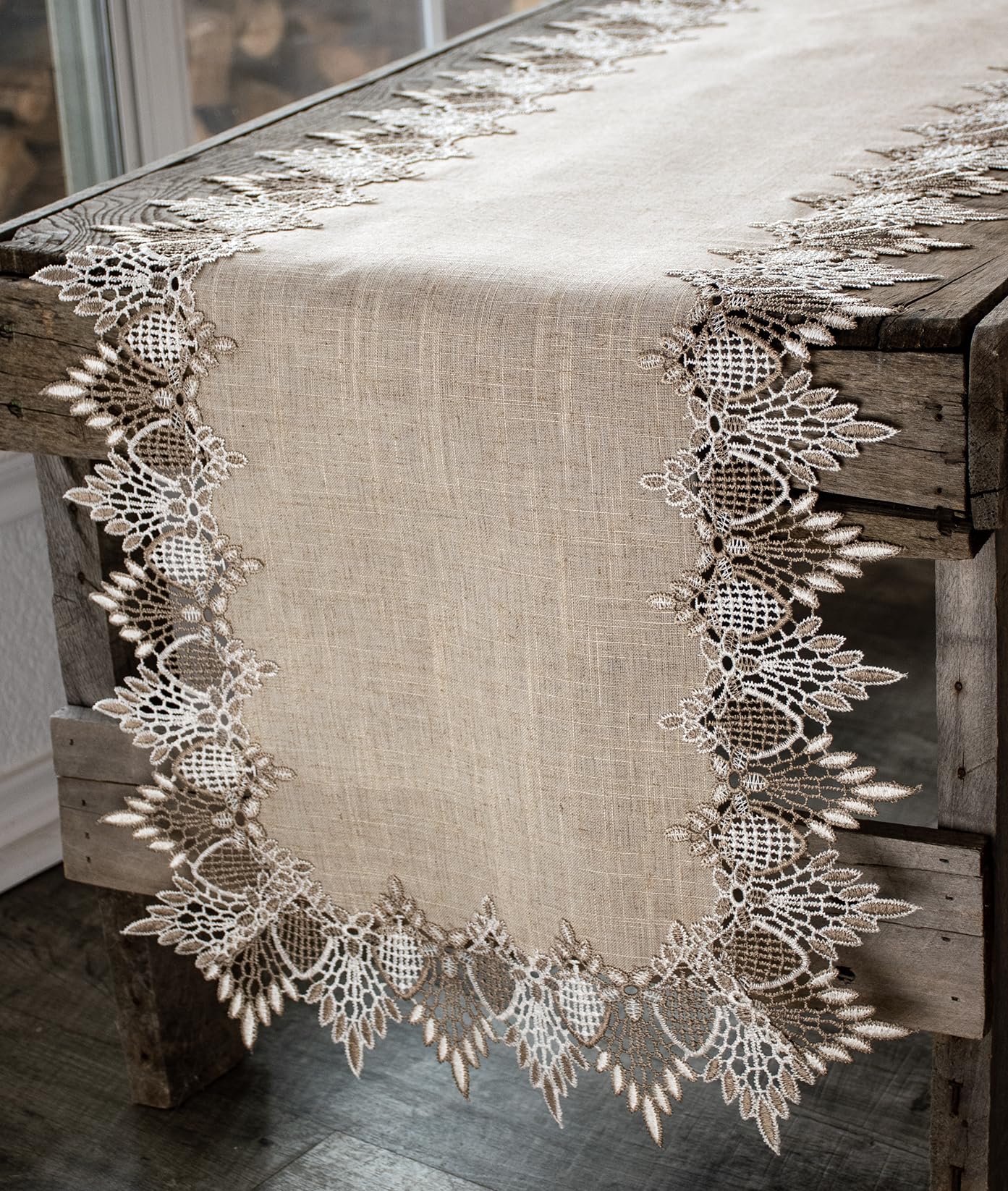 Linens, Art and Things lace runner with neutral beige pattern elevates table ambiance.