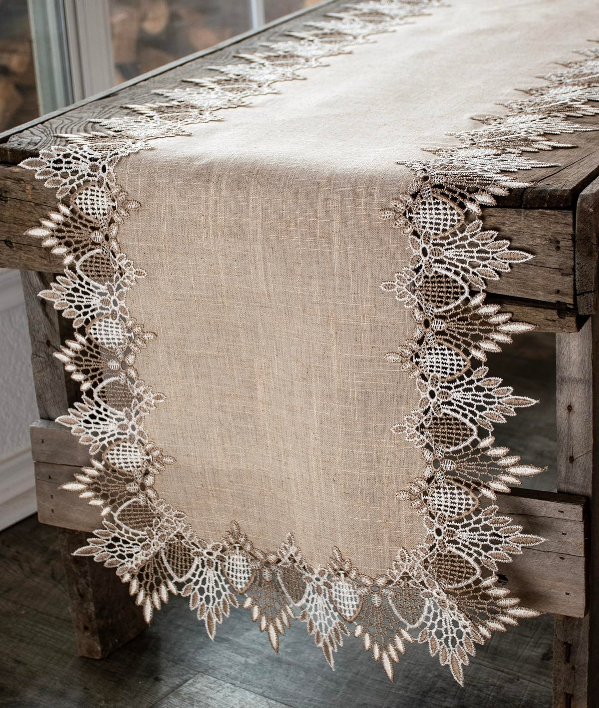 Linens, Art and Things lace runner with neutral beige pattern elevates table ambiance.
