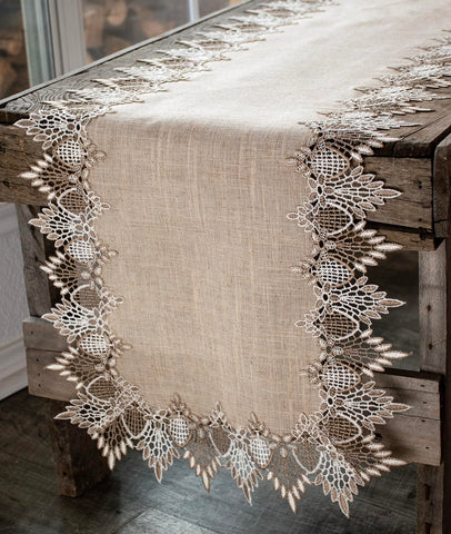 Linens, Art and Things lace runner with neutral beige pattern elevates table ambiance.