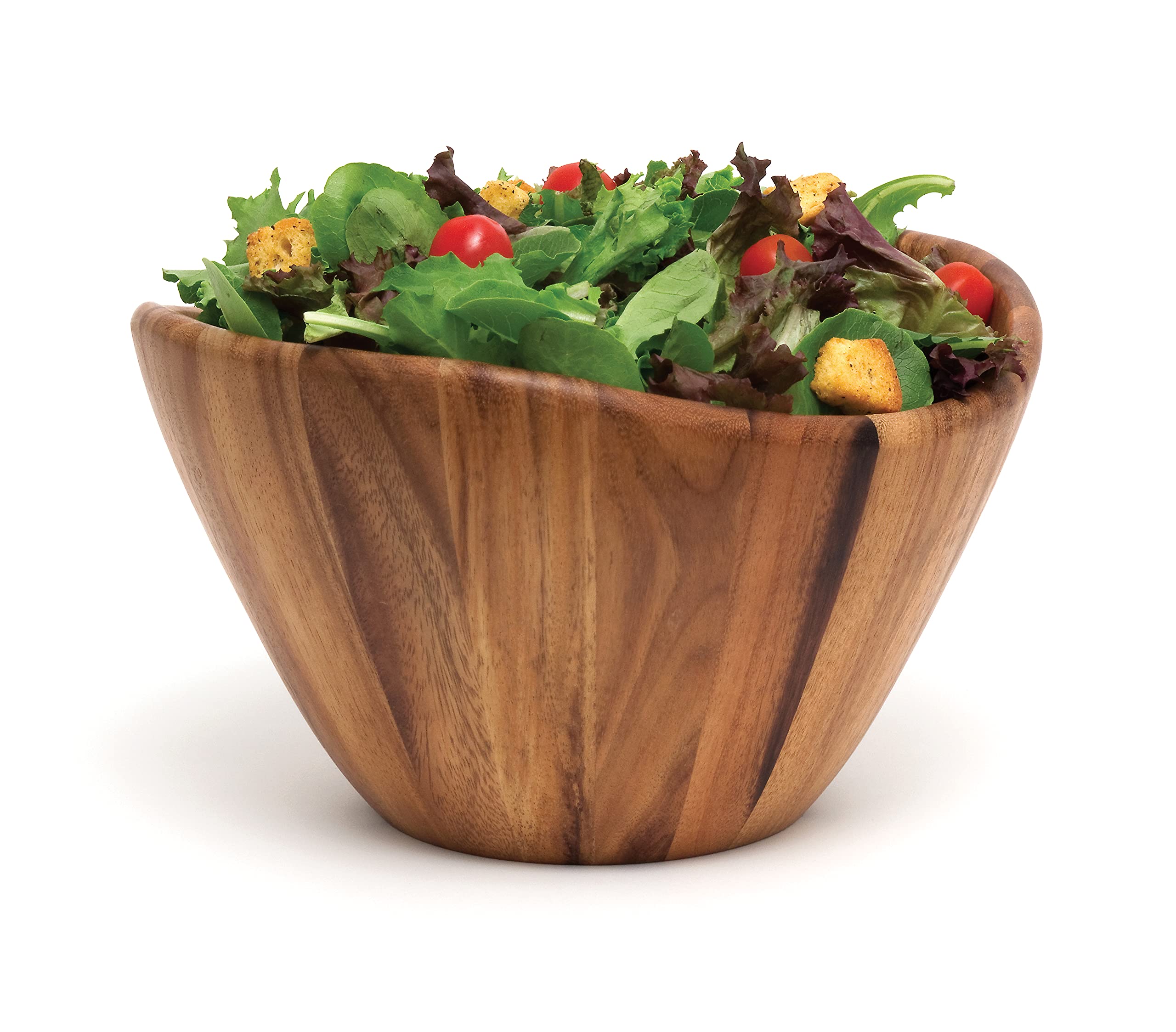 Lipper International acacia wave bowl as a centerpiece on a table.
