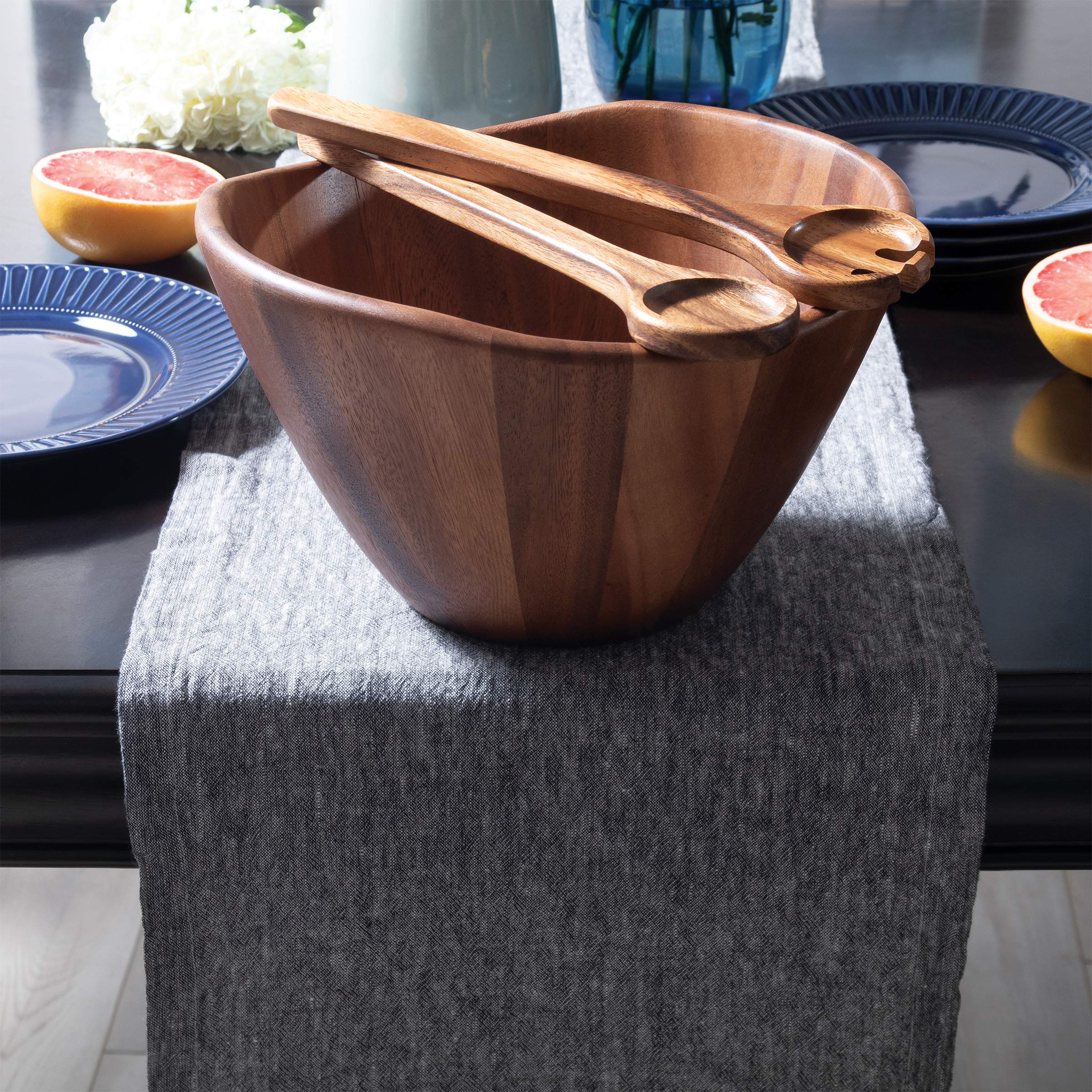 Brown finished Lipper wave bowl displayed on dining table.