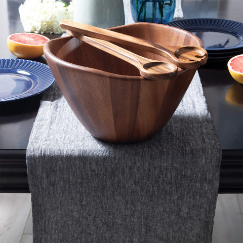 Brown finished Lipper wave bowl displayed on dining table.
