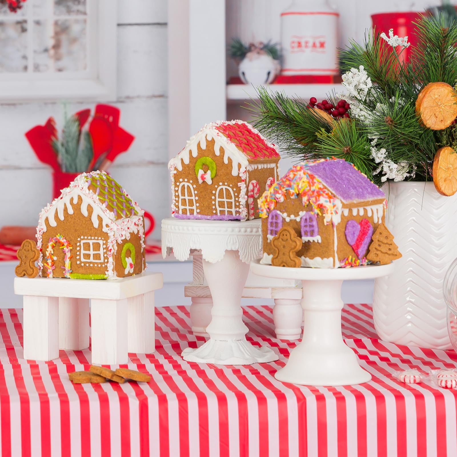 Gingerbread house kit contents laid out: cutters, mix, piping bag, colorings for safe decorating.