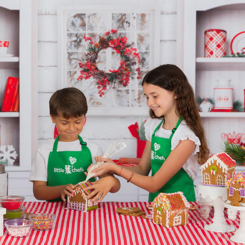 Kids decorating cookies with plant-based colorings for vibrant, allergen-free holiday treats.