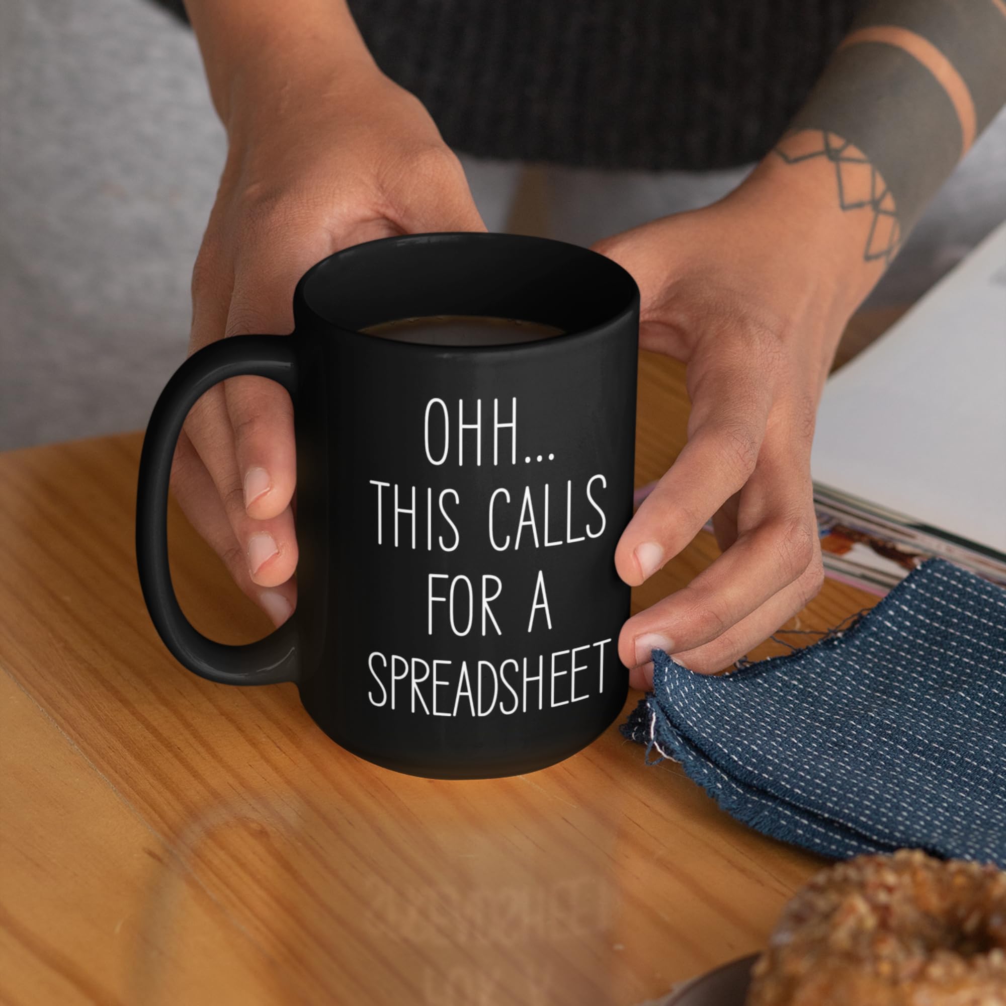 Livinges 15oz black mug with coffee on desk for productive mornings.