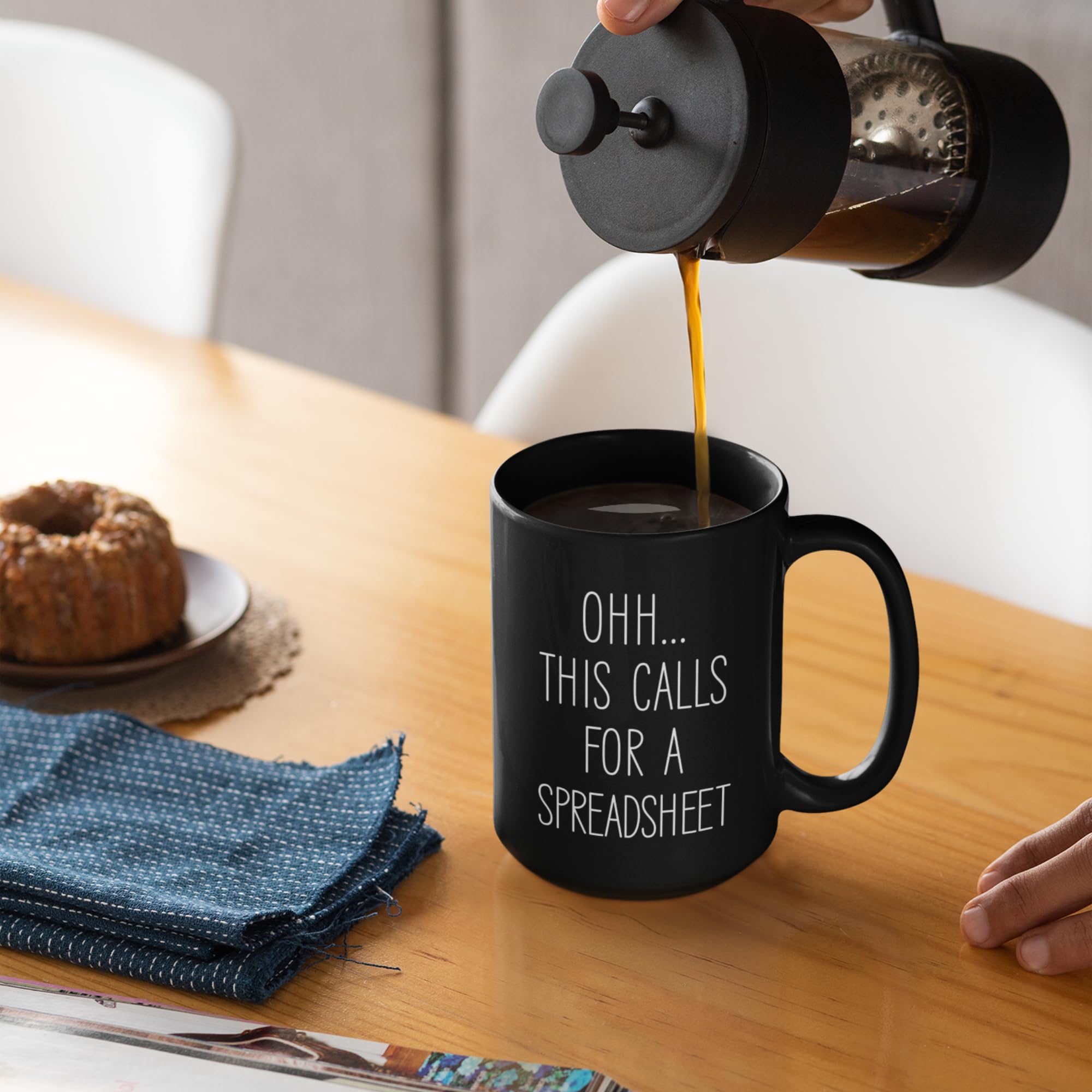 Livinges spreadsheet mug handle-tilt shot emphasizes comfortable grip.