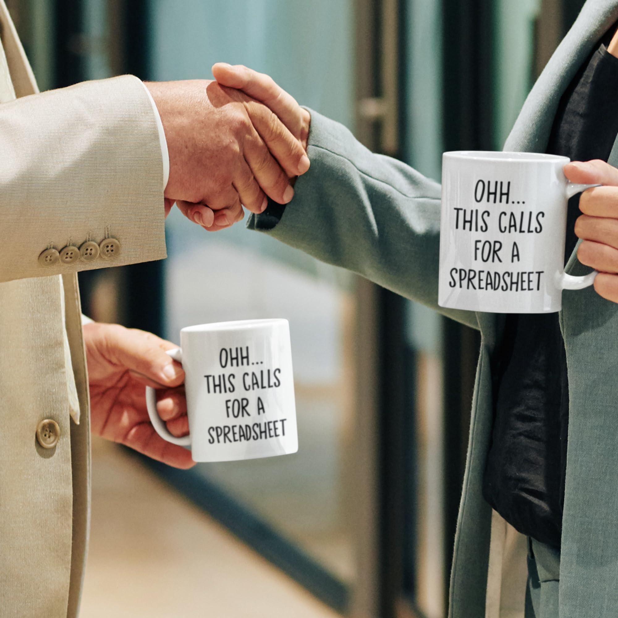 Livinges spreadsheet mug holding coffee; bold design boosts daily motivation.