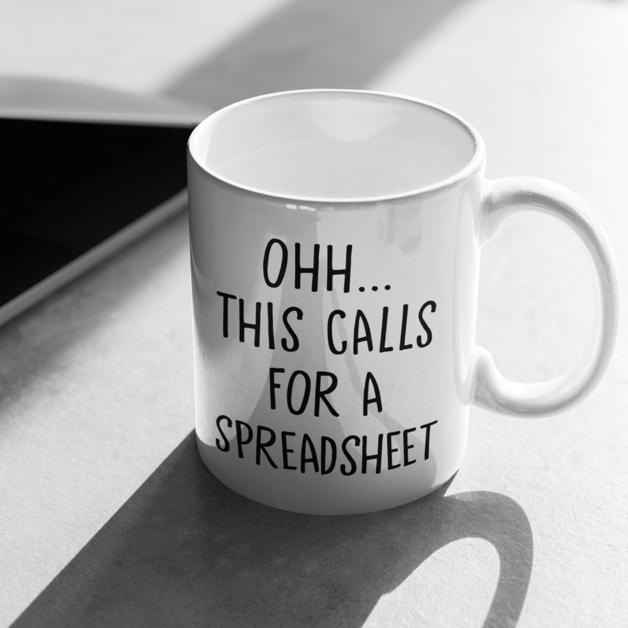 Livinges spreadsheet mug side right; easy sipping during meetings.