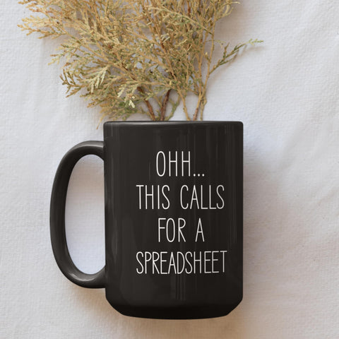 Livinges spreadsheet mug top view reveals bold black 15oz capacity.