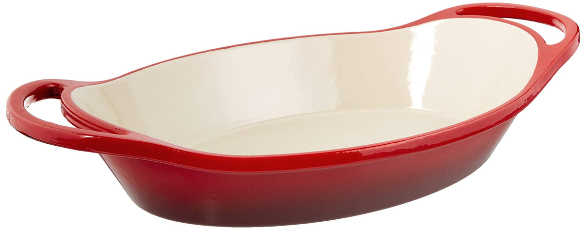 Lodge 2-quart enameled oval casserole in red, top view, ideal for braises and table service.
