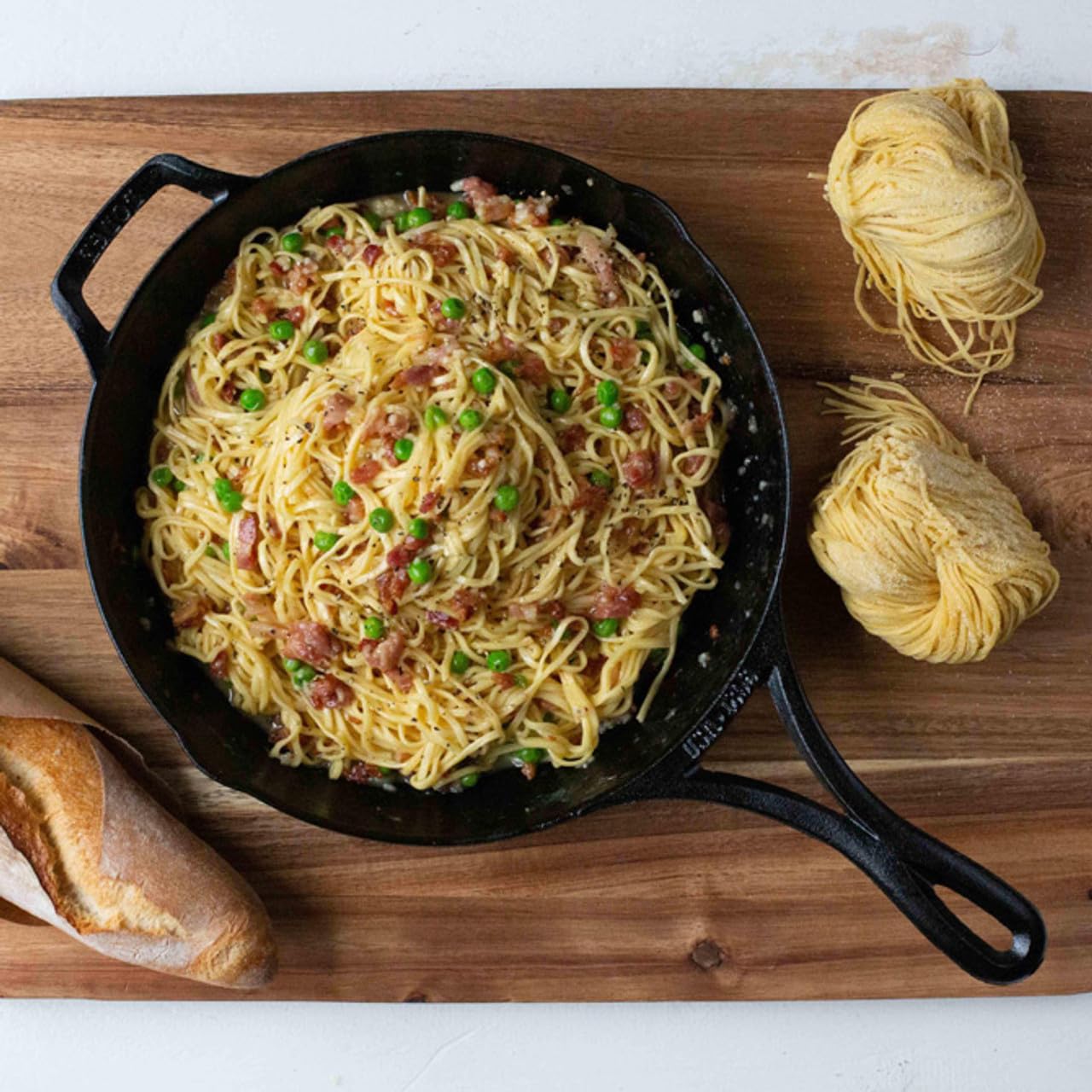 Lodge Blacklock sizzling on stove shows versatile cooking performance.