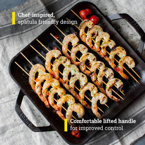 Lodge cast iron pan over open fire for open flame cooking