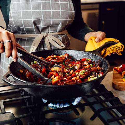 Lodge Chef Collection 12.5 inch wok in use searing steaks for flavorful crust