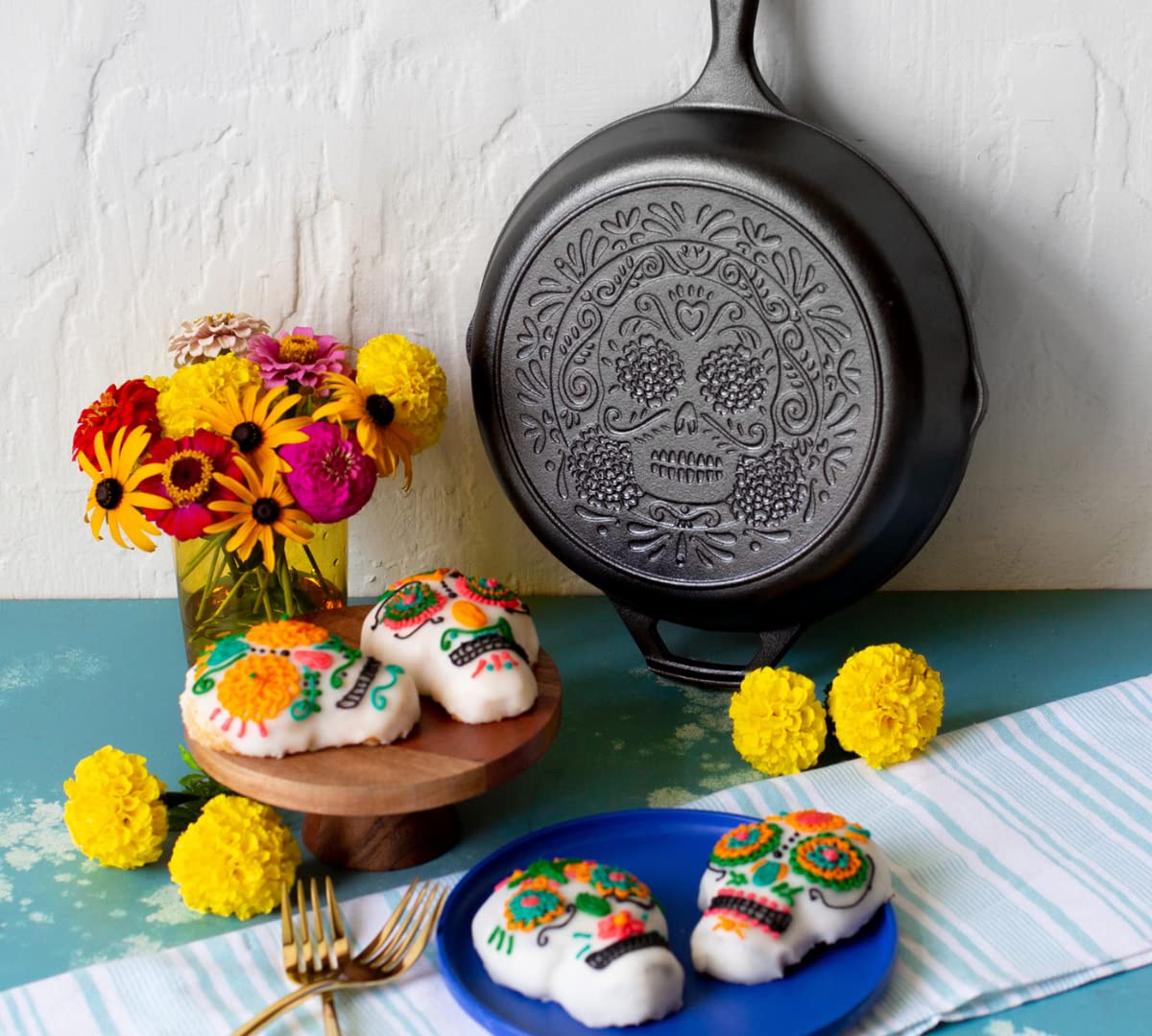 Lodge Sugar Skull skillet detail with marigold skull artwork.