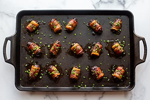 Lodge baking pan with two handles for easy lift and transfer.