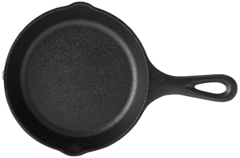 Lodge Wildlife Series wolf skillet on stove demonstrates even heating for searing