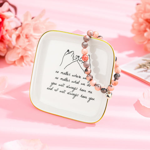 Looca natural rose-scented candle with calming aroma.