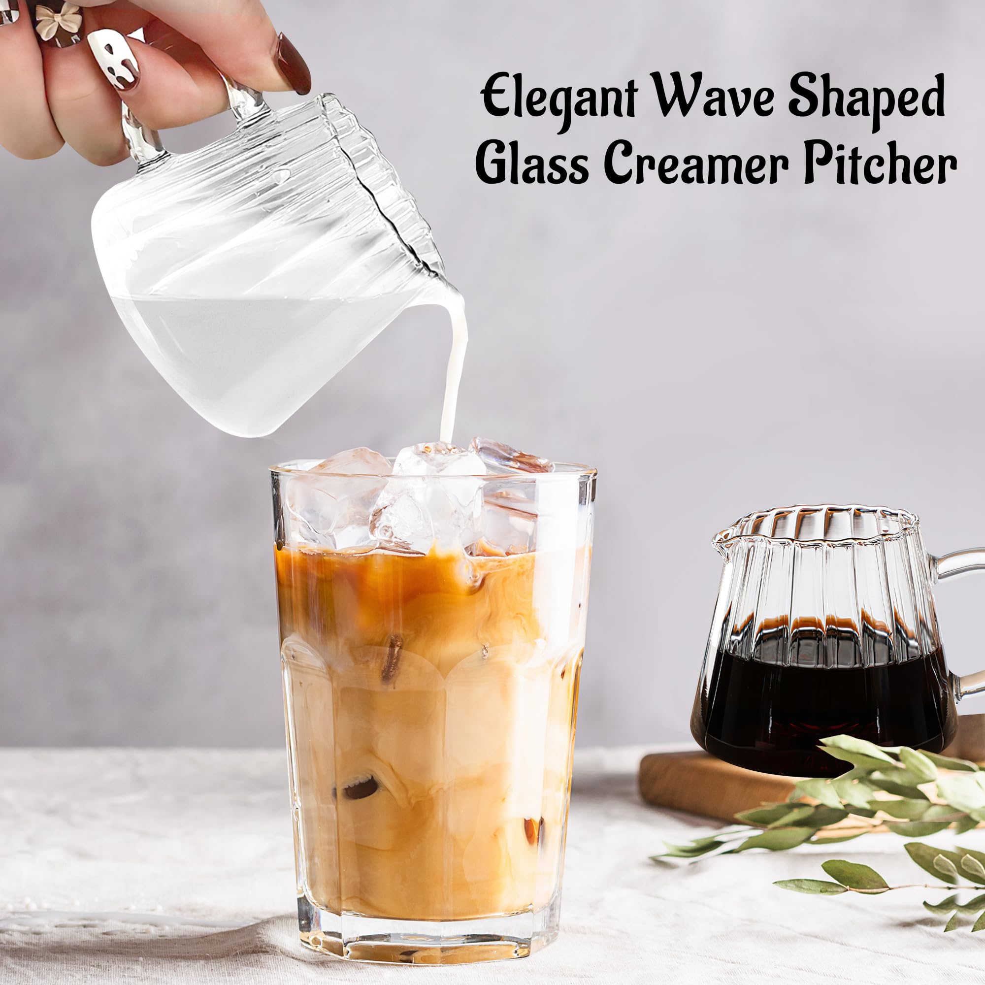 Two elegant glass pitchers display froth-ready milk for café-quality coffee at home.