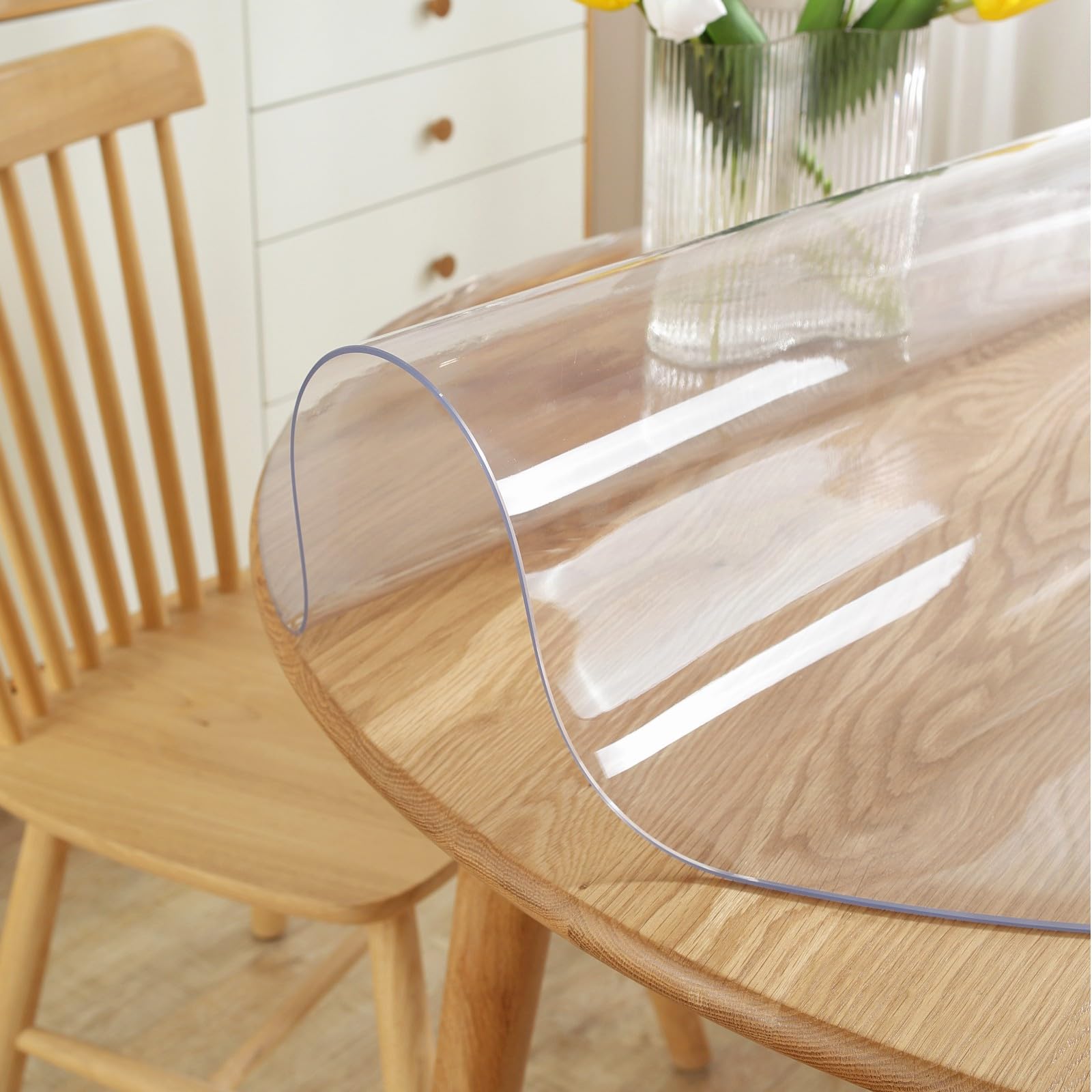 LovePads round clear table cover in use on a dining table