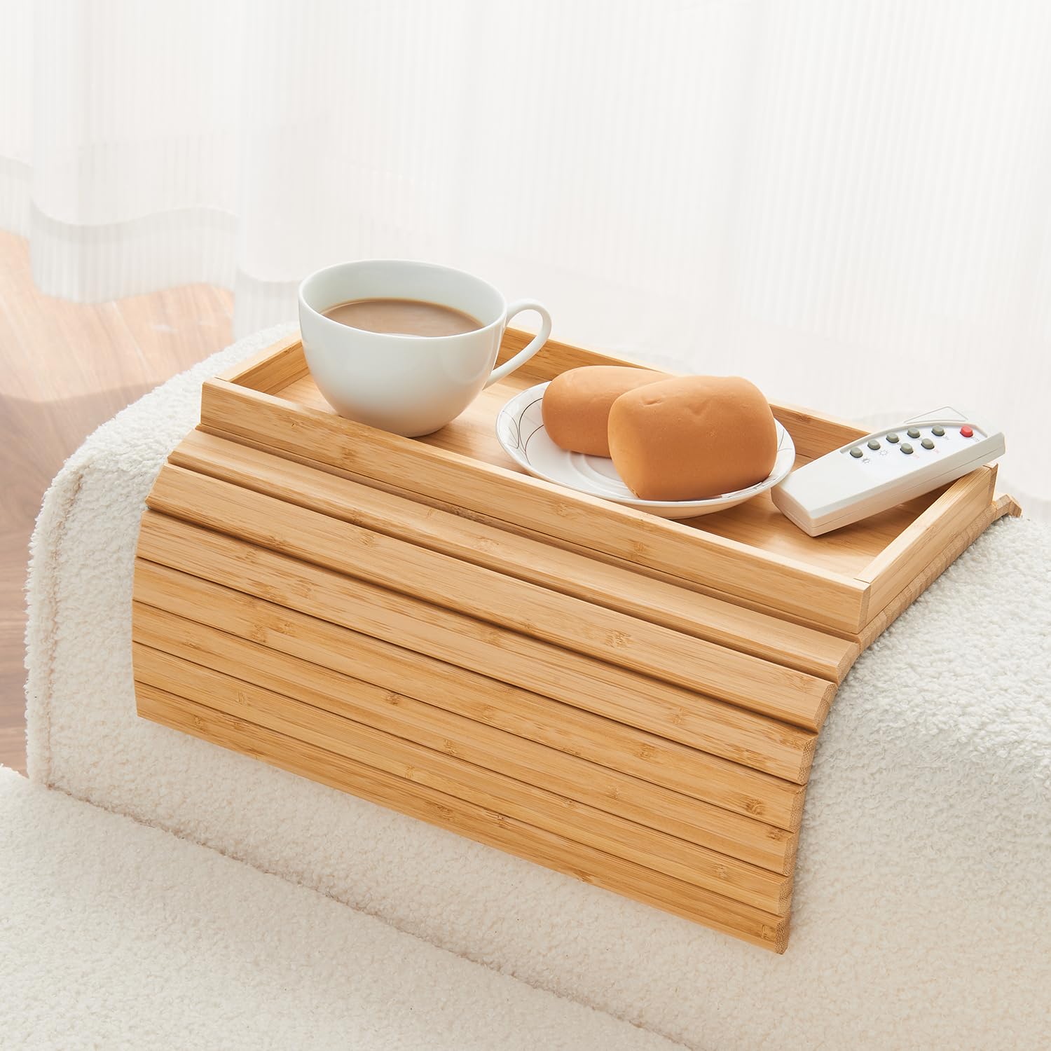 LOVYANXUE bamboo arm tray on sofa armrest holding drinks and snacks.