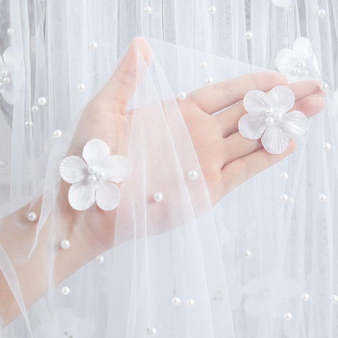 LuoluoHouse pearl tulle fabric close-up highlights attached pearls for durable elegance.