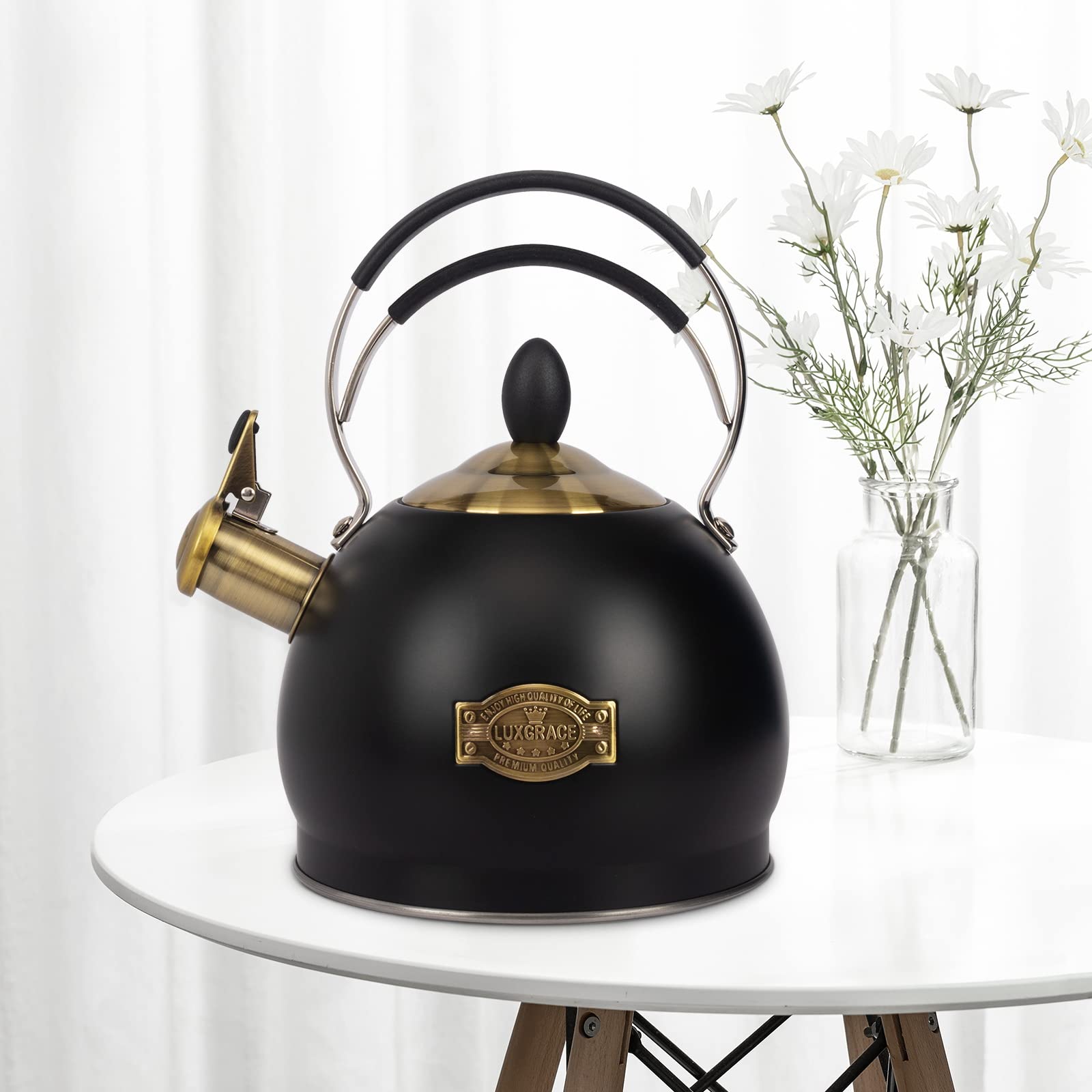 LUXGRACE ergonomic handle on the tea kettle for safe pouring.