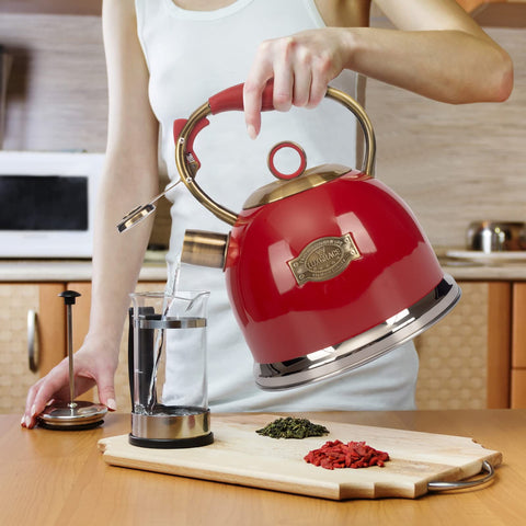 Bright red LuxGrace kettle on a stove adds kitchen color