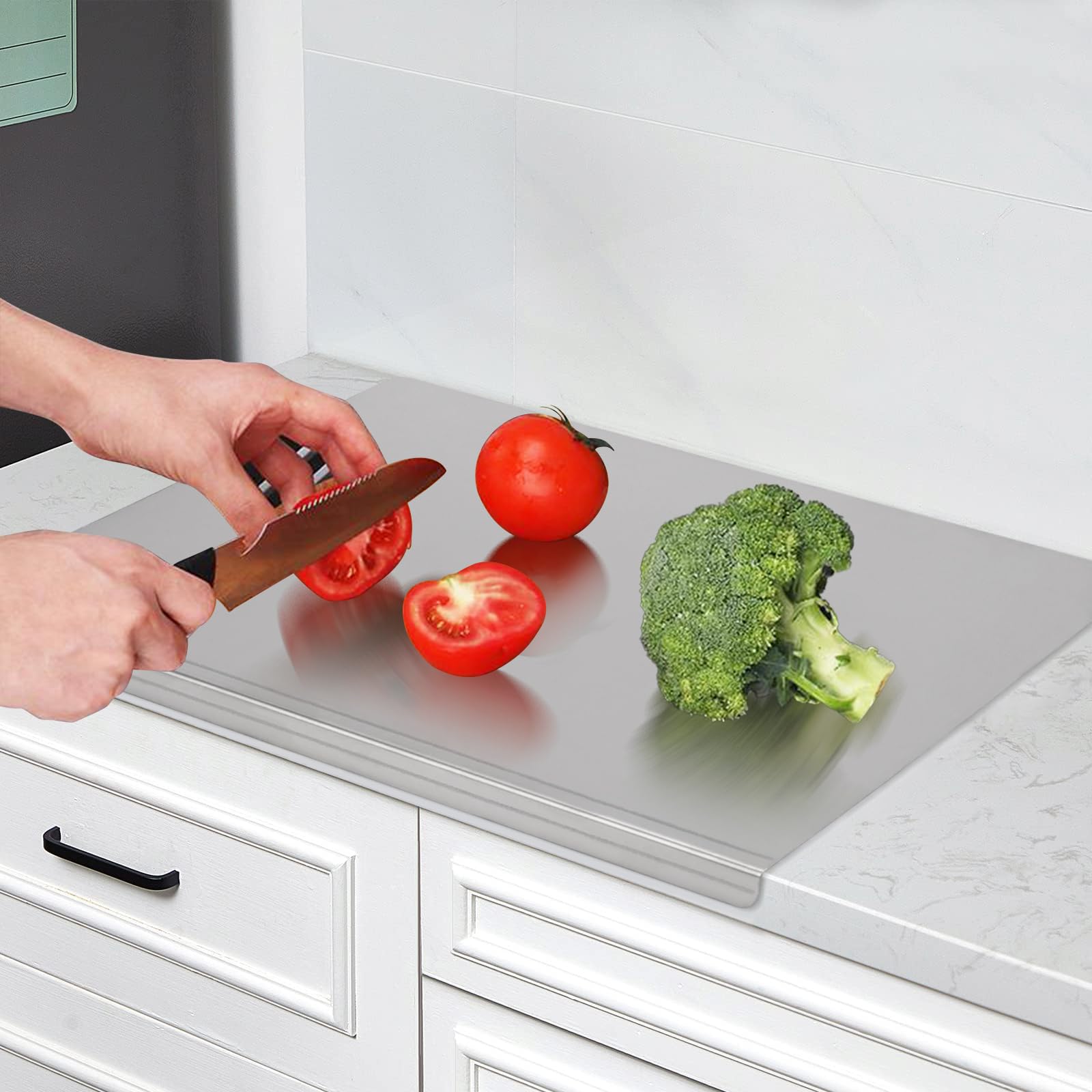 LYHLYA stainless steel cutting board with lipped edge helps prevent spills during slicing.