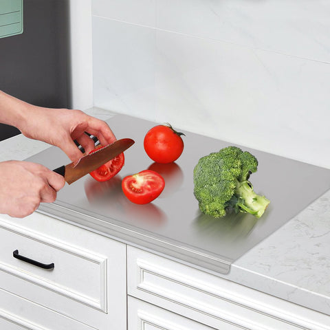 LYHLYA stainless steel cutting board with lipped edge helps prevent spills during slicing.