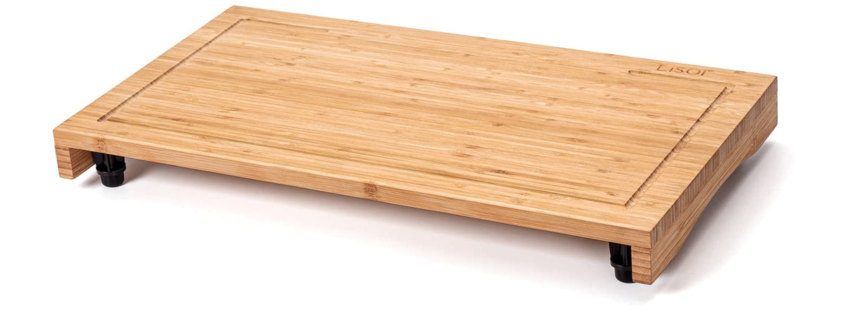 Lynicon bamboo stovetop cover with adjustable legs, offering stable elevated workspace over the stove.