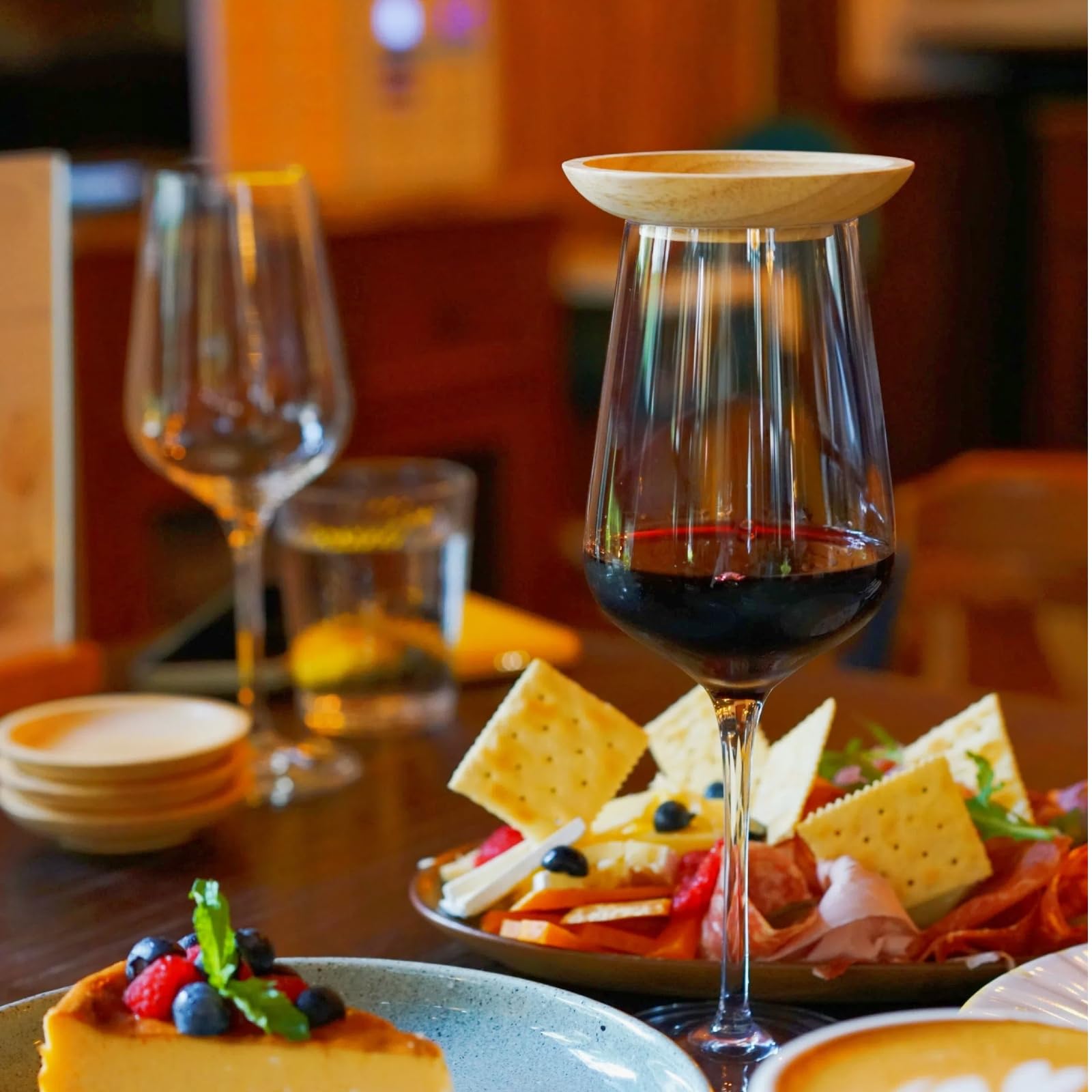 Lyonbi wine topper arranged on table during a casual gathering.