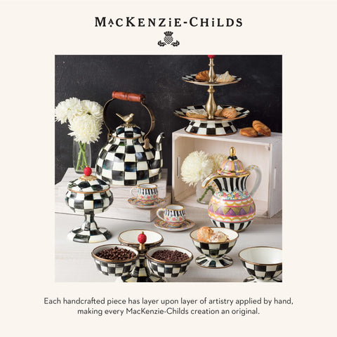 MacKenzie-Childs ceramic napkin holder with gloss finish adds decorative charm.