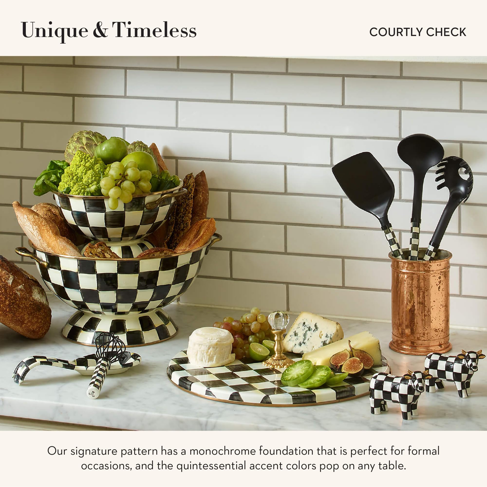 MacKenzie-Childs cheese board with clear glass knob for easy handling.