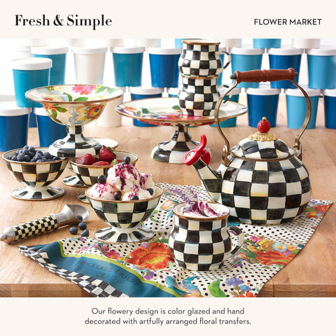 Mackenzie-Childs dish towel on polka-dot backdrop adds playful elegance.