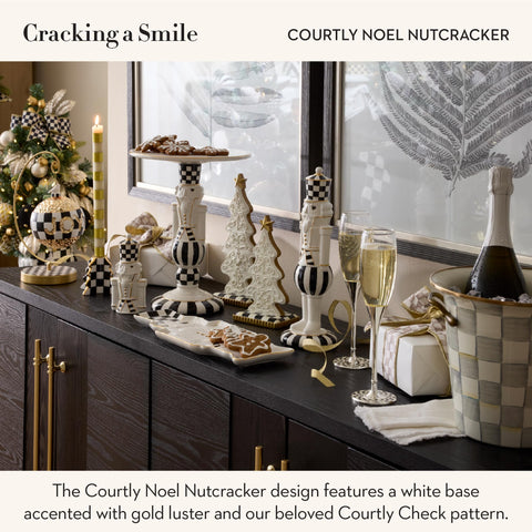 Courtly Noel Nutcracker decor from MacKenzie-Childs on a dining table