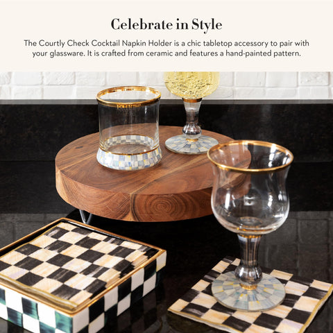 MacKenzie-Childs napkin holder on table display for easy napkin access.