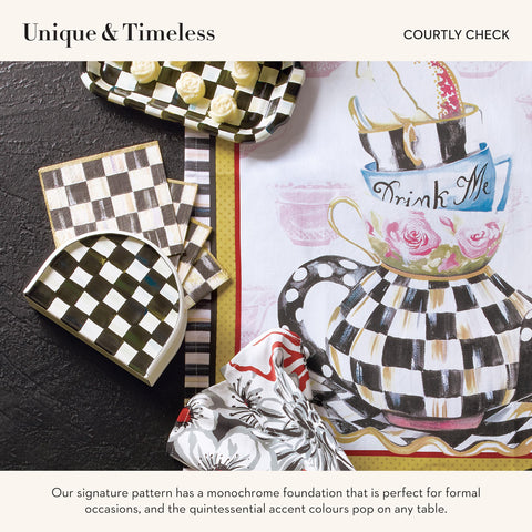 MACKENZIE-CHILDS napkin holder on table display elevates dining moments.