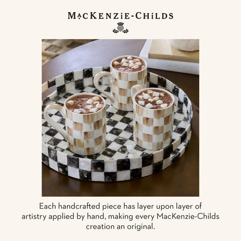 MacKenzie-Childs porcelain mug shown as part of a curated home collection