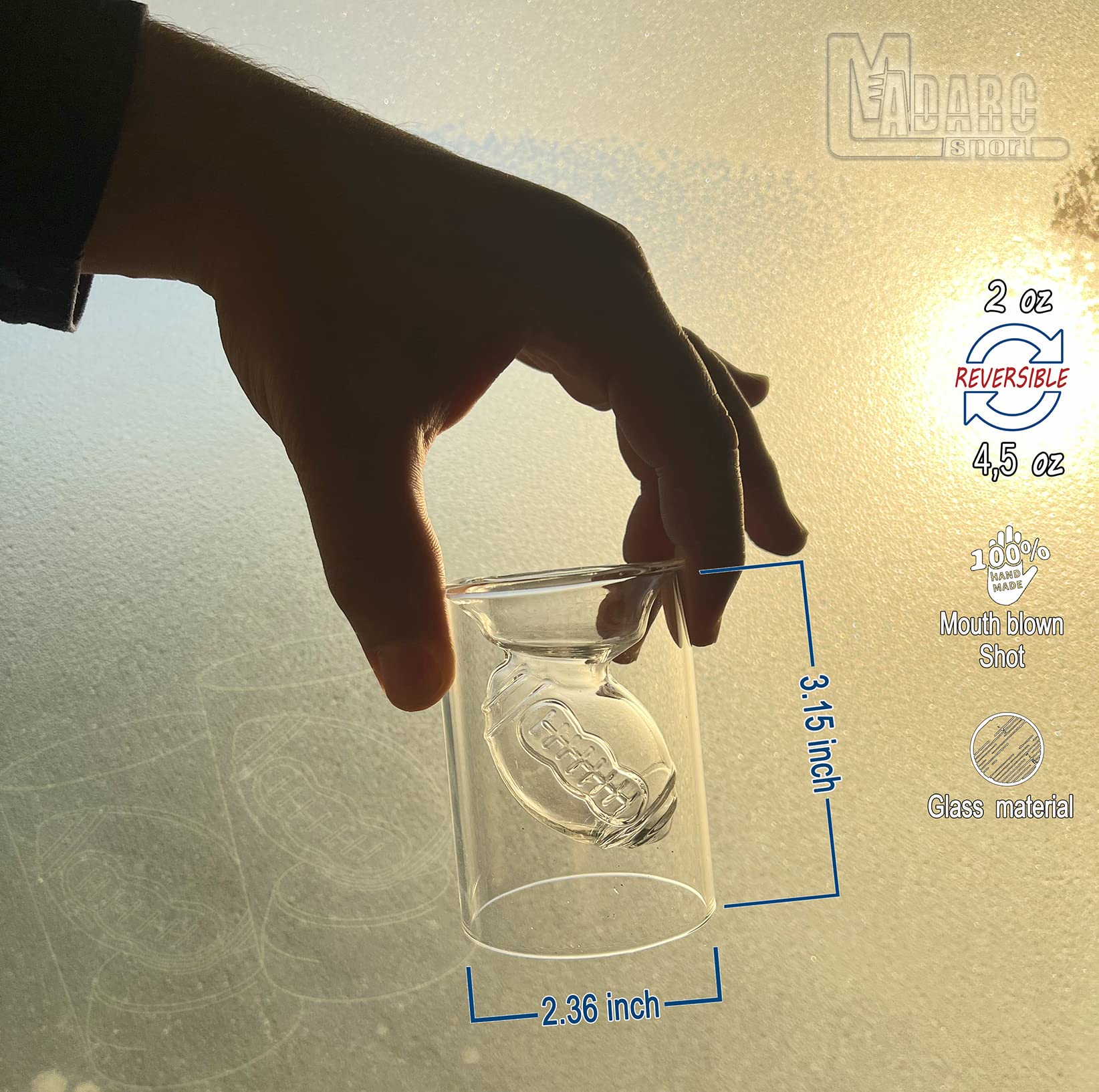 MADARC SPORT reversible football-design shot glasses for flexible pouring options.