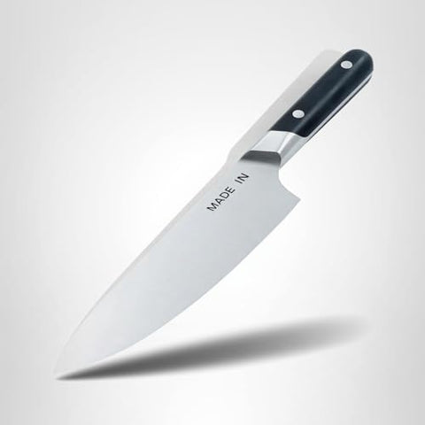 Made In 8-inch Chef Knife on cutting board ready for slicing tasks.