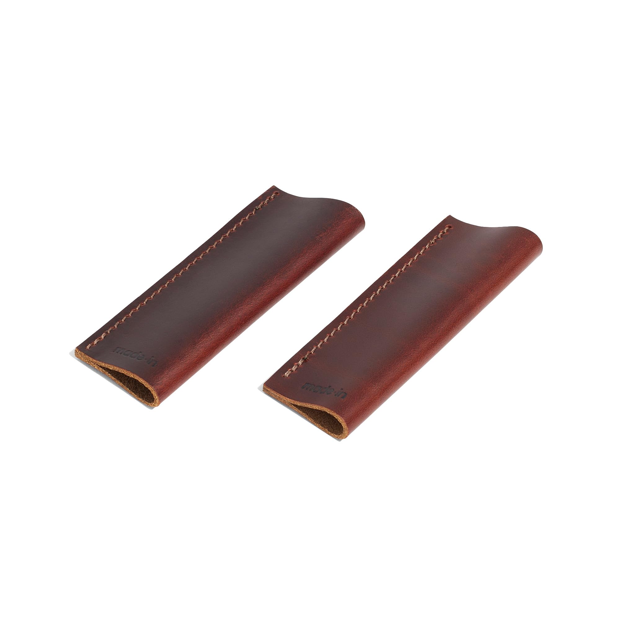 Made In leather handle covers fitted to carbon steel griddle for precise protection.
