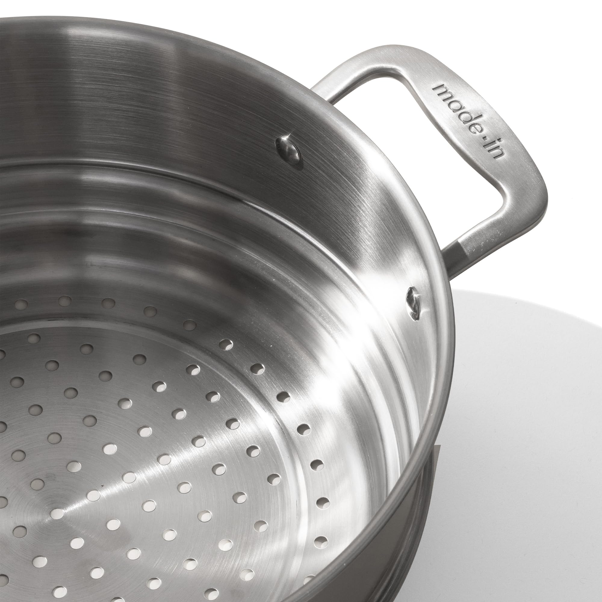 Made In steamer insert shows 5-ply stainless clad construction for durable heat distribution.