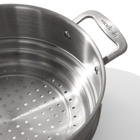 Made In steamer insert shows 5-ply stainless clad construction for durable heat distribution.