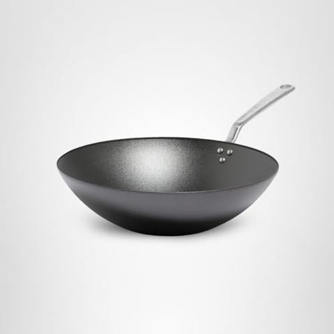 Made In wok seasoning progress improves natural nonstick for easy food release.