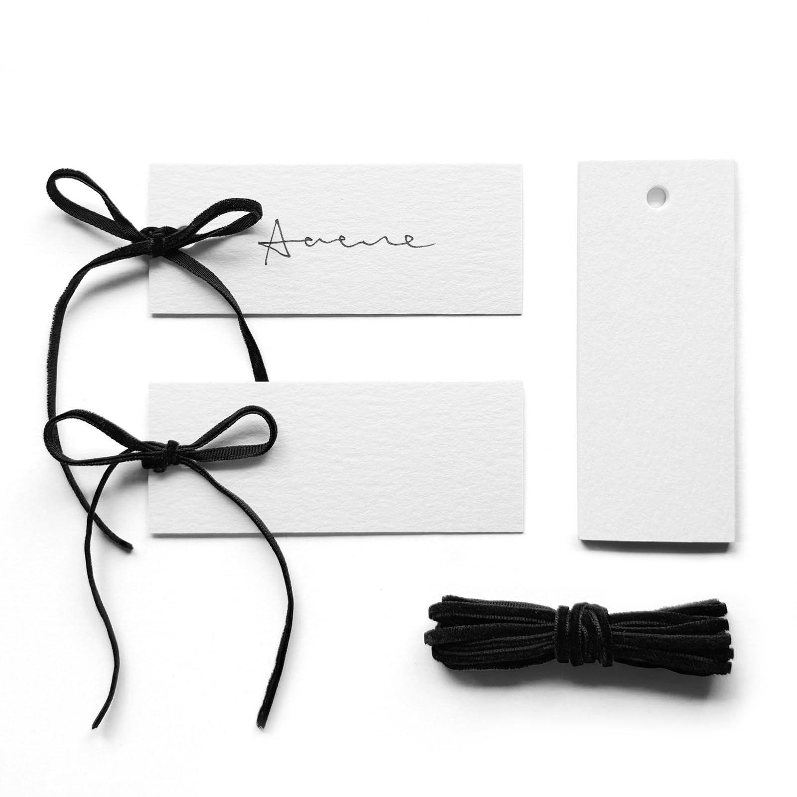 Maegmew black place card with velvet ribbon for refined table styling.